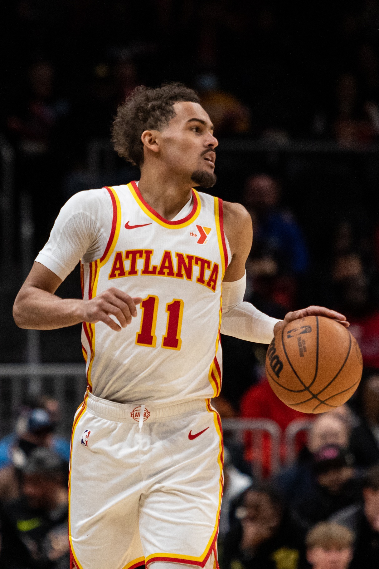 Atlanta Hawks guard Trae Young (11) dribbles the ball down the court in the game against Orlando Magic during the fourth quarter at State Farm Arena.