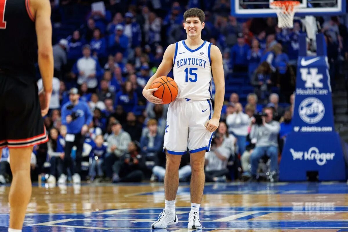 Kentucky Wildcats guard Reed Sheppard (15) smiles and holds the ball at the end of the game against the Georgia Bulldogs at Rupp Arena at Central Bank Center.