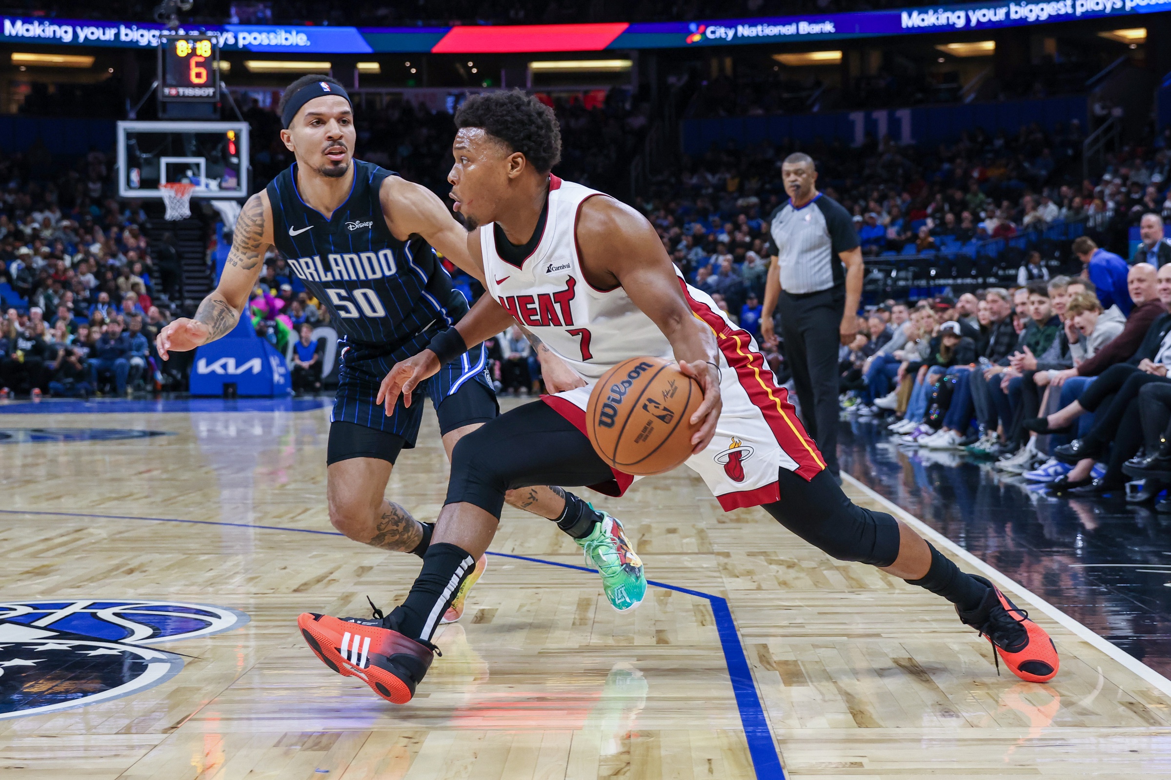Miami Heat guard Kyle Lowry (7) drives around Orlando Magic guard Cole Anthony (50) during the second quarter at Amway Center.