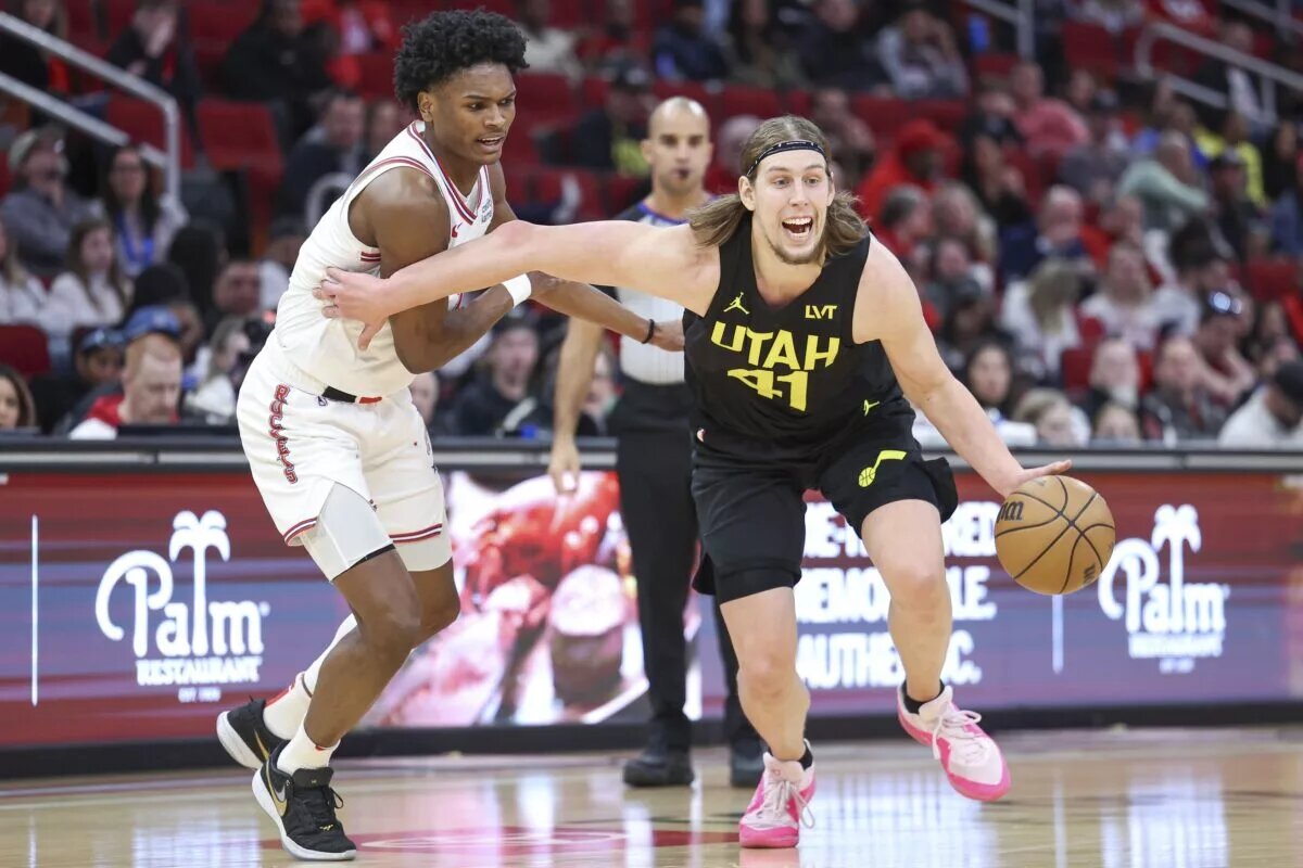 Jan 20, 2024; Houston, Texas, USA; Utah Jazz forward Kelly Olynyk (41) in action as Houston Rockets forward Amen Thompson (1) defends during the game at Toyota Center. Mandatory Credit: Troy Taormina-USA TODAY Sports