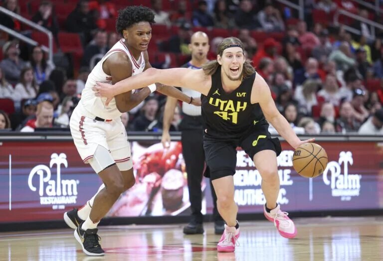 Jan 20, 2024; Houston, Texas, USA; Utah Jazz forward Kelly Olynyk (41) in action as Houston Rockets forward Amen Thompson (1) defends during the game at Toyota Center. Mandatory Credit: Troy Taormina-USA TODAY Sports