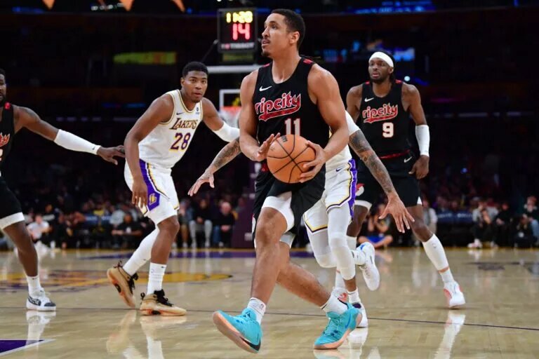 Jan 21, 2024; Los Angeles, California, USA; Portland Trail Blazers guard Malcolm Brogdon (11) moves to the basket against the against the Los Angeles Lakers during the first half at Crypto.com Arena. Mandatory Credit: Gary A. Vasquez-USA TODAY Sports