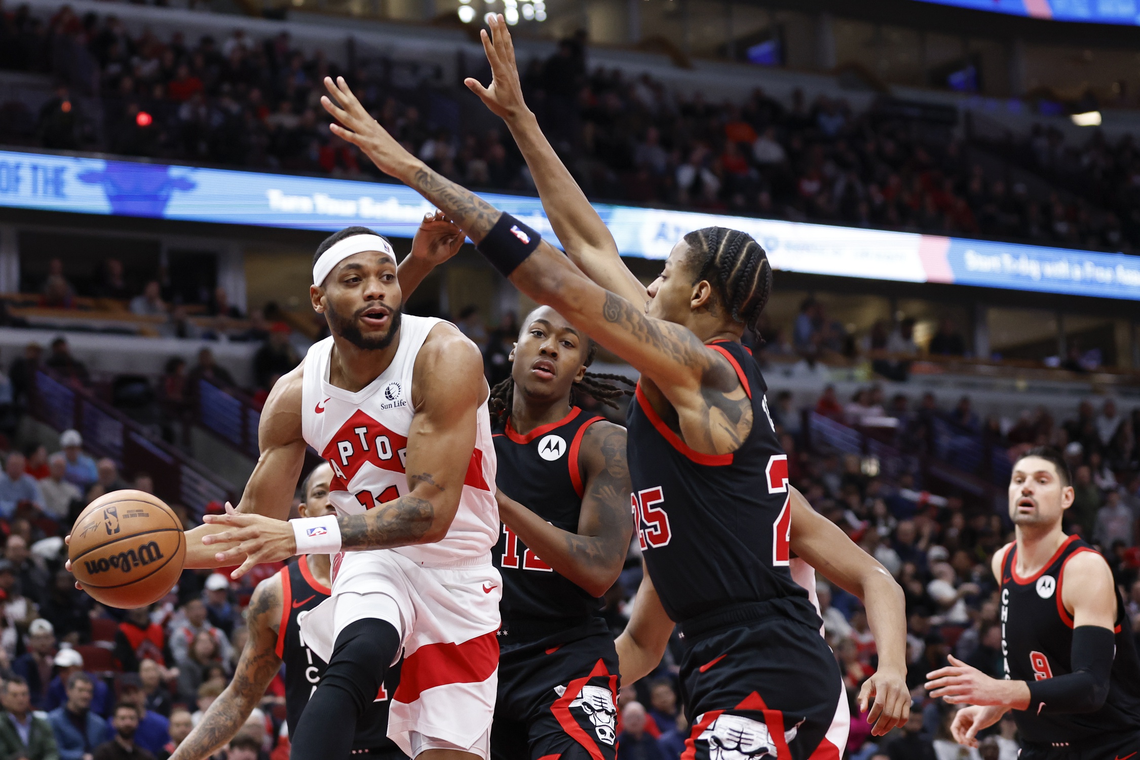 Jan 30, 2024; Chicago, Illinois, USA; Toronto Raptors forward Bruce Brown (11) drives to the basket against the Chicago Bulls during the first half at United Center. Mandatory Credit: Kamil Krzaczynski-USA TODAY Sports