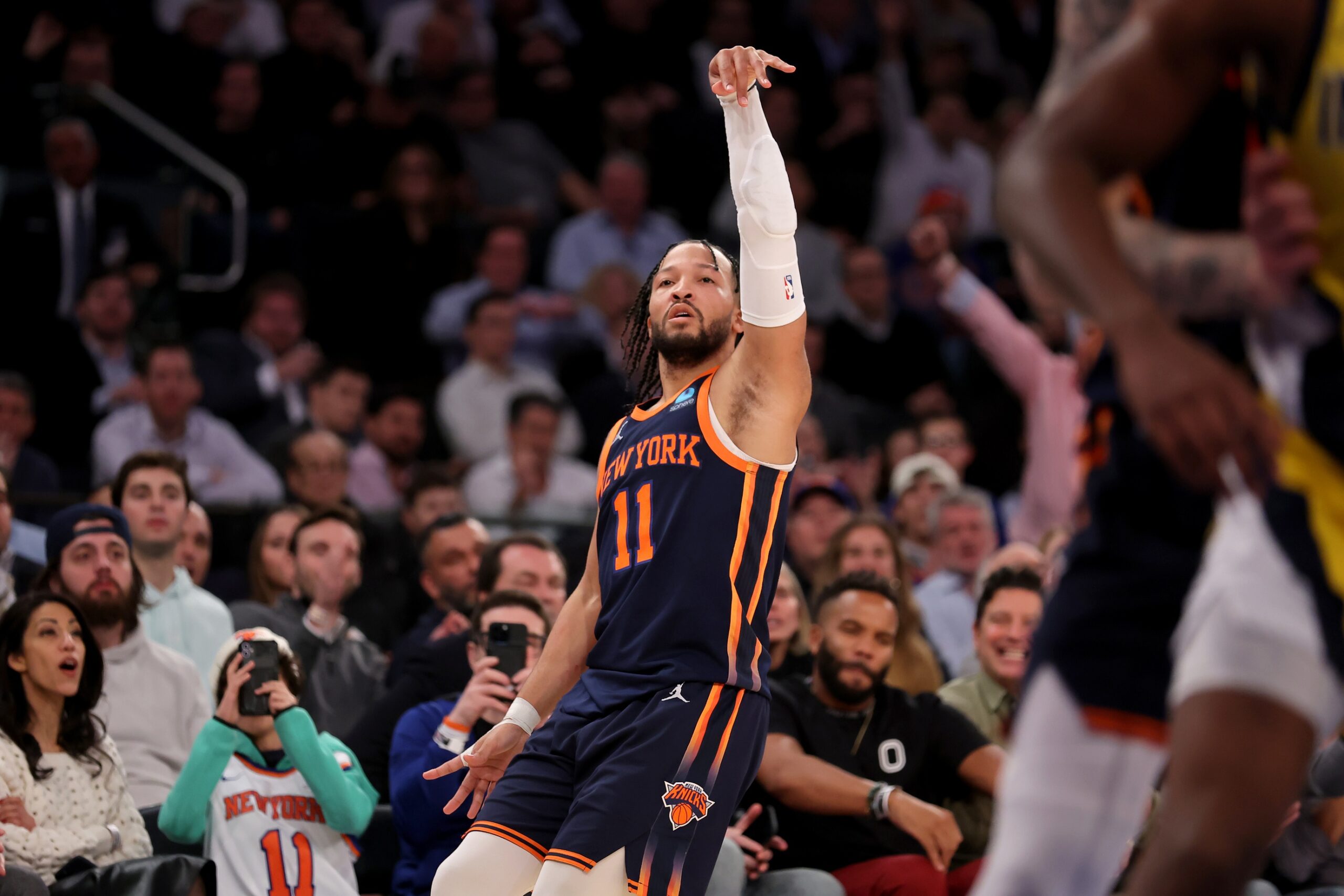 New York Knicks guard Jalen Brunson (11) watches his three point shot against the Indiana Pacers during the fourth quarter at Madison Square Garden.
