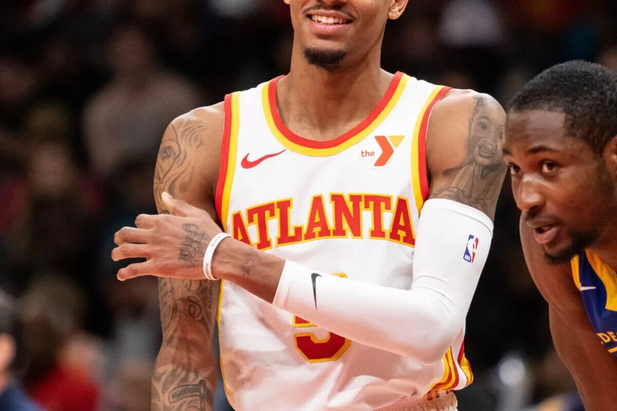 Atlanta Hawks guard Dejounte Murray (5) reacts in game against Golden State Warriors during the fourth quarter at State Farm Arena.