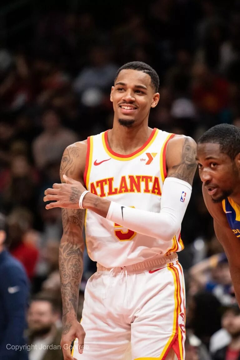 Atlanta Hawks guard Dejounte Murray (5) reacts in game against Golden State Warriors during the fourth quarter at State Farm Arena.