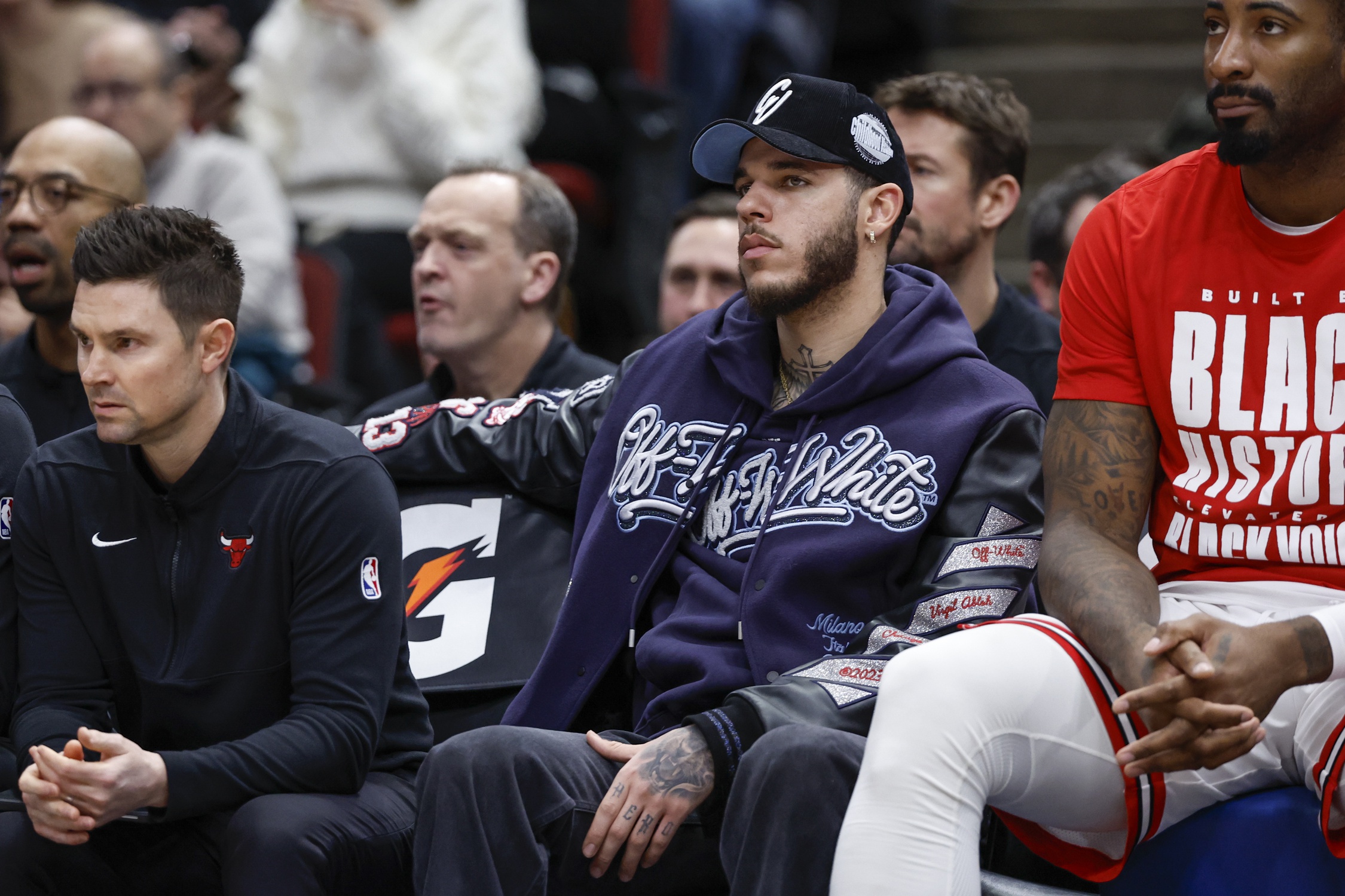 Injured Chicago Bulls guard Lonzo Ball (2) sits on the bench during the first half of a basketball game against the Sacramento Kings at United Center.