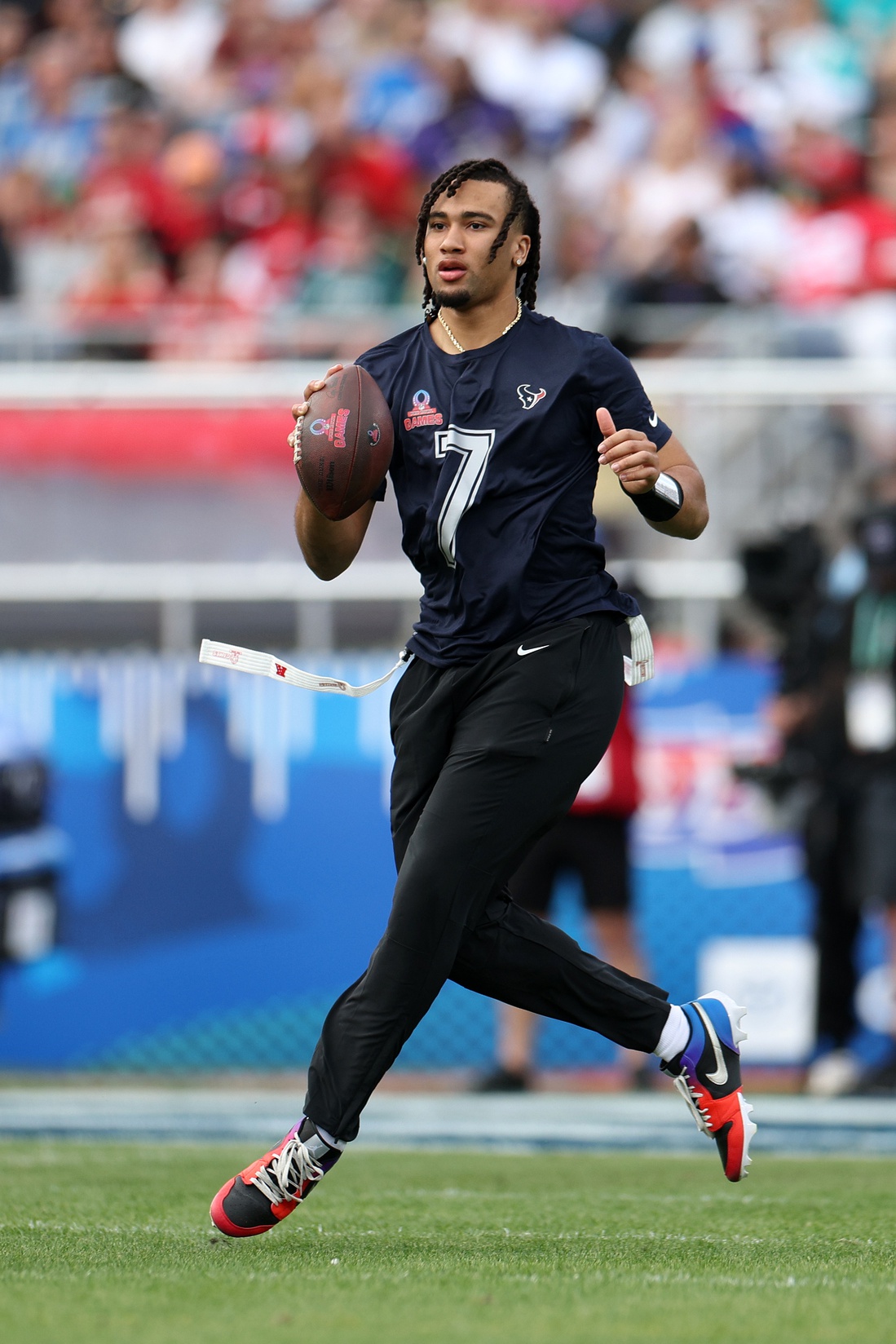 AFC quarterback C.J. Stroud (7) of the Houston Texans drops back to pass during the 2024 Pro Bowl at Camping World Stadium.