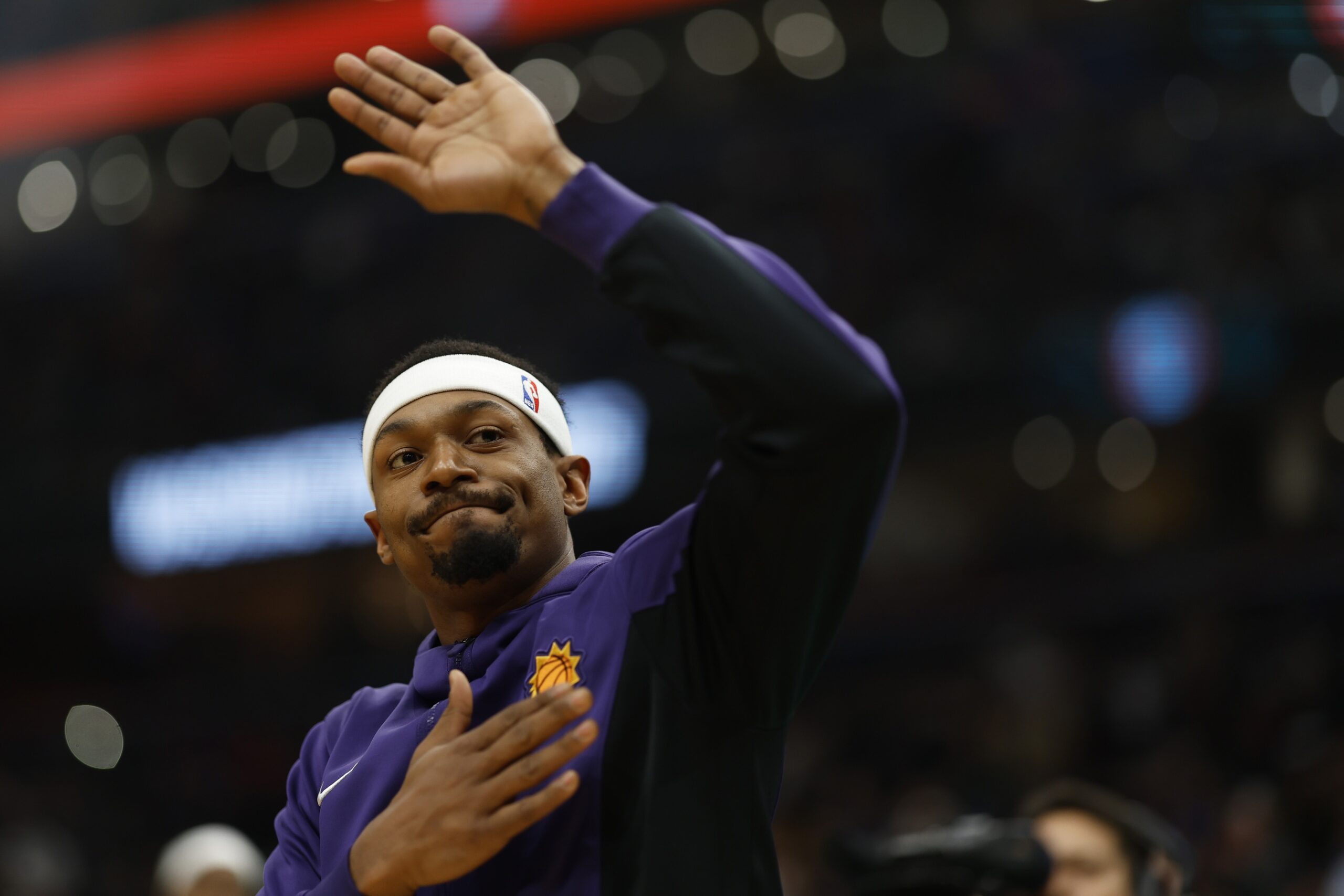 Phoenix Suns guard Bradley Beal (3) waves to the crowd while being introduced prior his return to Washington after being traded in the offseason against the Washington Wizards at Capital One Arena.