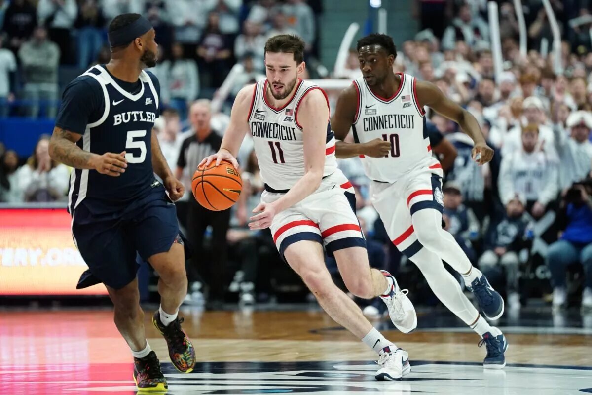 Feb 6, 2024; Hartford, Connecticut, USA; UConn Huskies forward Alex Karaban (11) returns the ball against Butler Bulldogs guard Posh Alexander (5) in the second half at XL Center. Mandatory Credit: David Butler II-USA TODAY Sports