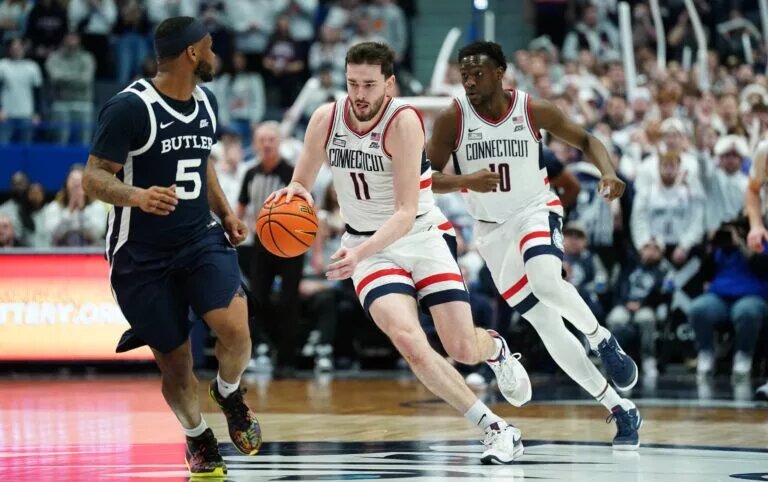 Feb 6, 2024; Hartford, Connecticut, USA; UConn Huskies forward Alex Karaban (11) returns the ball against Butler Bulldogs guard Posh Alexander (5) in the second half at XL Center. Mandatory Credit: David Butler II-USA TODAY Sports