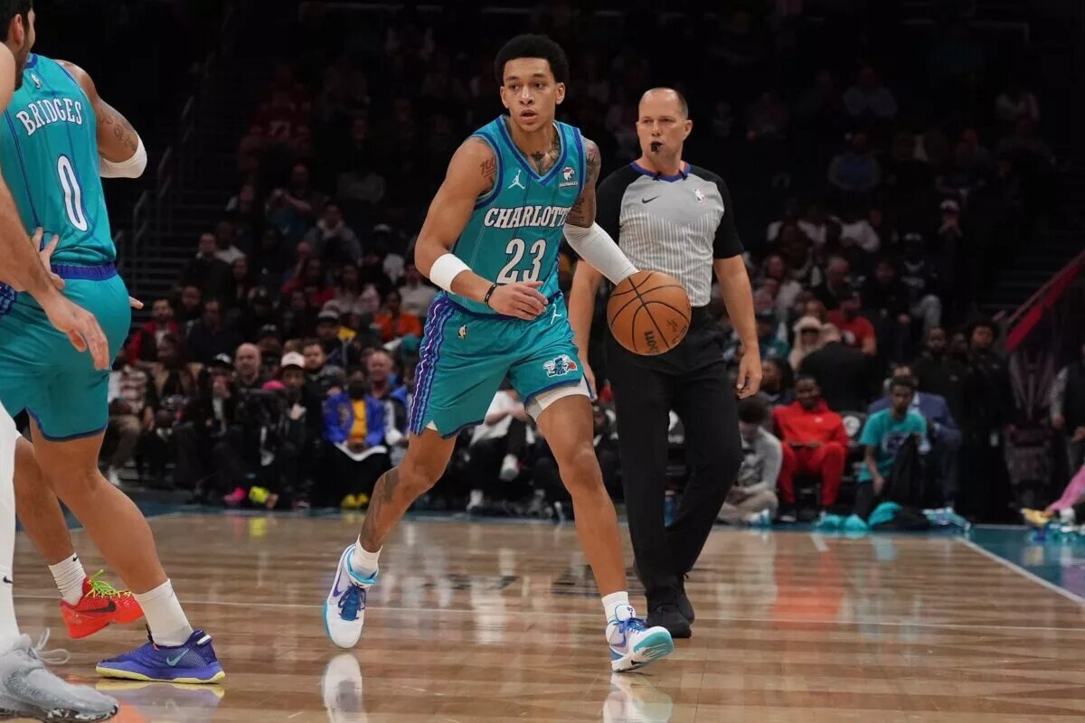Charlotte Hornets guard Tre Mann (23) handles the ball against the Memphis Grizzlies during the first quarter at Spectrum Center.