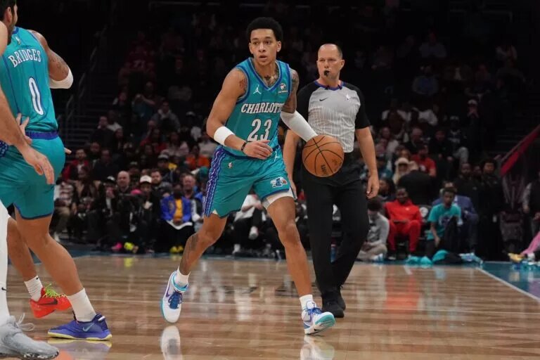 Charlotte Hornets guard Tre Mann (23) handles the ball against the Memphis Grizzlies during the first quarter at Spectrum Center.