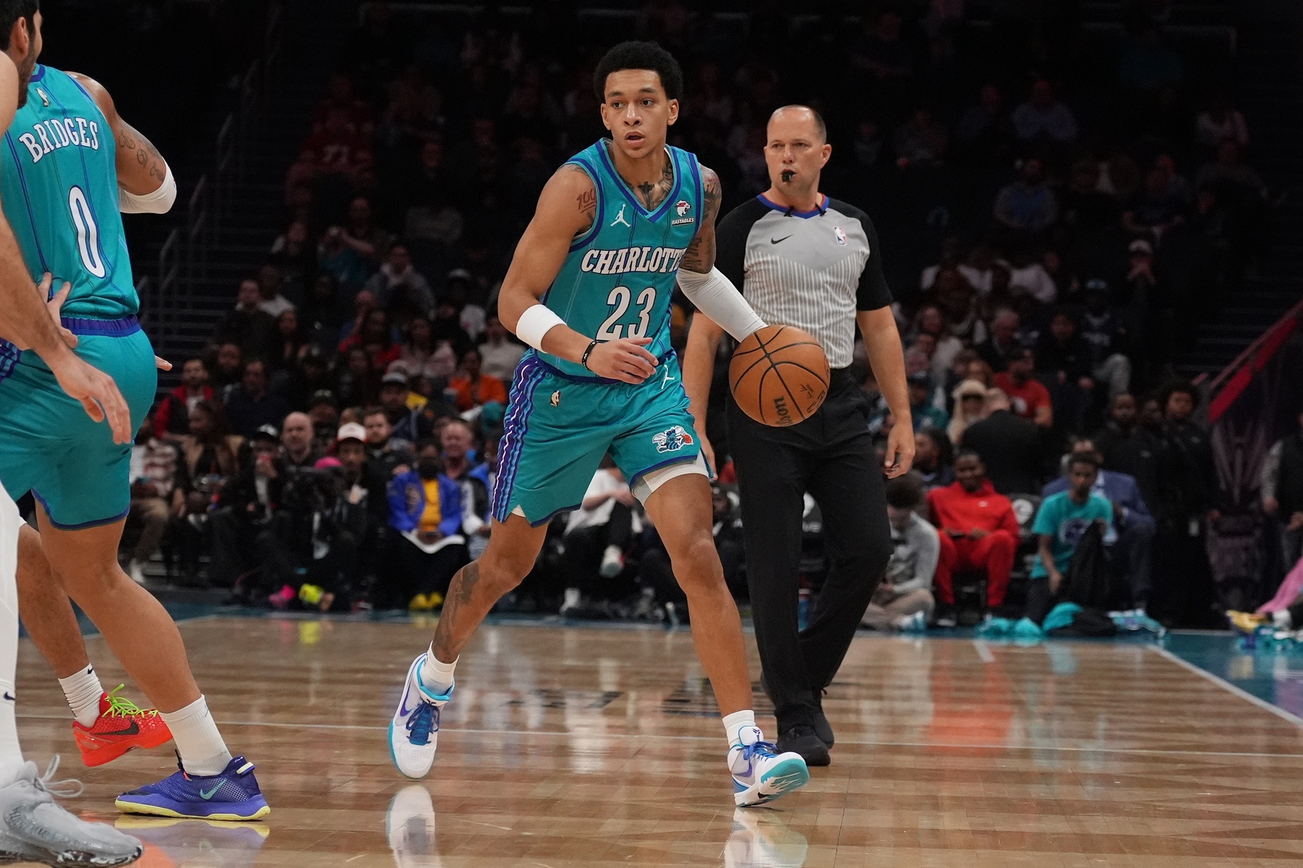 Charlotte Hornets guard Tre Mann (23) handles the ball against the Memphis Grizzlies during the first quarter at Spectrum Center.