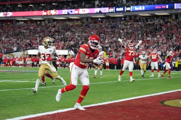 Feb 11, 2024; Paradise, Nevada, USA; Kansas City Chiefs wide receiver Mecole Hardman Jr. (12) scores a touchdown against the San Francisco 49ers in overtime during Super Bowl LVIII at Allegiant Stadium. Mandatory Credit: Kirby Lee-USA TODAY Sports