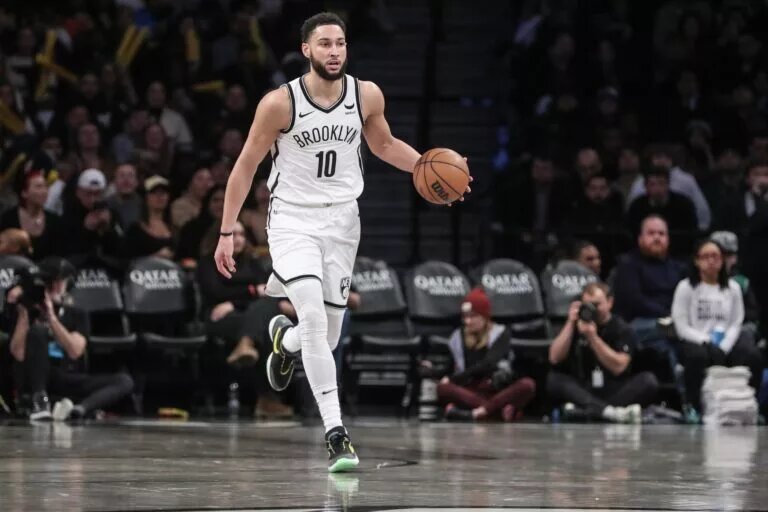 Brooklyn Nets guard Ben Simmons (10) brings the ball up court in the third quarter against the Boston Celtics at Barclays Center.