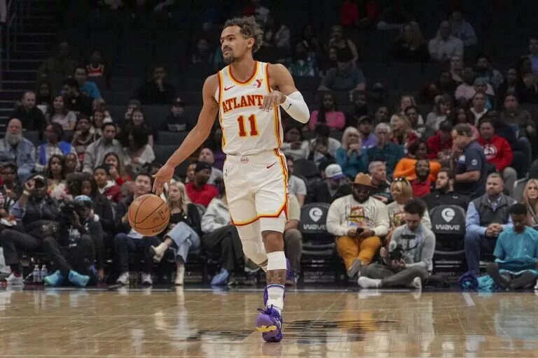 Atlanta Hawks guard Trae Young (11) handles the ball against the Charlotte Hornets during the first quarter at Spectrum Center.
