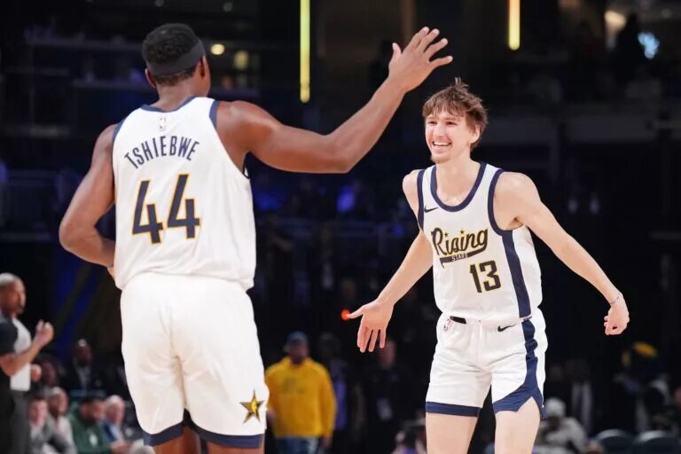 Feb 16, 2024; Indianapolis, Indiana, USA; Team Detlef forward Matas Buzelis (13) of the G League Ignite reacts after a play with center Oscar Tshiebwe (44) of the Indiana Mad Ants during a Rising Stars semifinal game at Gainbridge Fieldhouse. Mandatory Credit: Kyle Terada-USA TODAY Sports