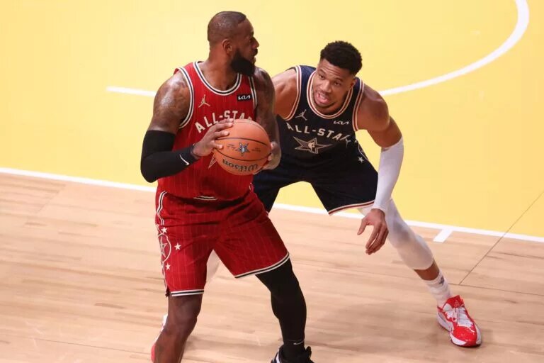 Eastern Conference forward Giannis Antetokounmpo (34) of the Milwaukee Bucks defends Western Conference forward LeBron James (23) of the Los Angeles Lakers during the first quarter in the 73rd NBA All Star game at Gainbridge Fieldhouse.
