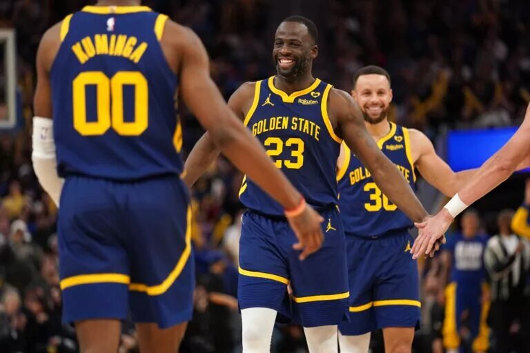 Golden State Warriors forward Draymond Green (23) smiles after the Warriors made a basket against the Los Angeles Lakers at the end of the third quarter at the Chase Center.
