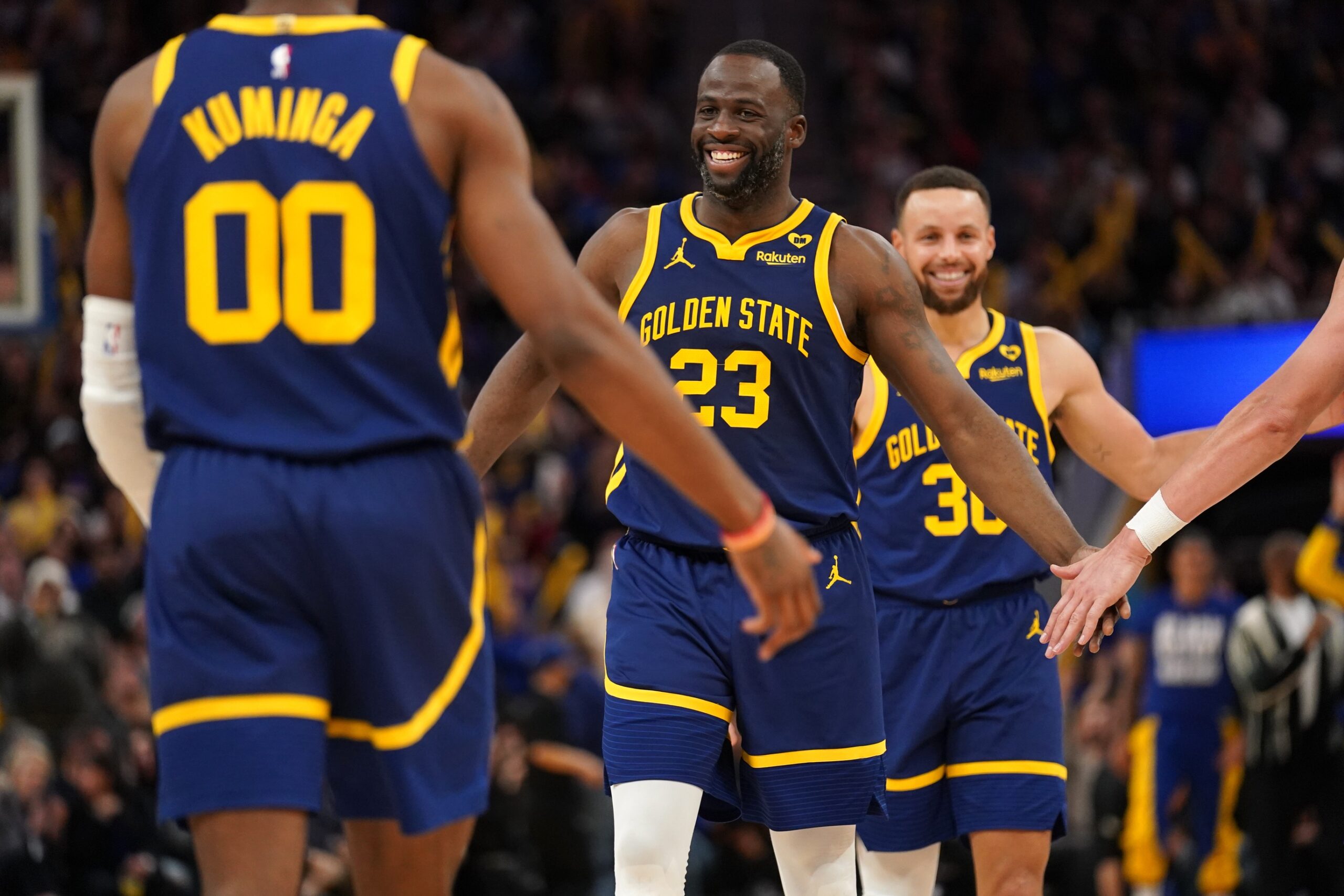 Golden State Warriors forward Draymond Green (23) smiles after the Warriors made a basket against the Los Angeles Lakers at the end of the third quarter at the Chase Center.