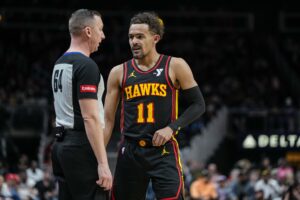 Feb 23, 2024; Atlanta, Georgia, USA; Atlanta Hawks guard Trae Young (11) disputes a call with official Justin Van Duyne (64) before being called for a technical foul during the game against the Toronto Raptors during the first half at State Farm Arena. Mandatory Credit: Dale Zanine-USA TODAY Sports