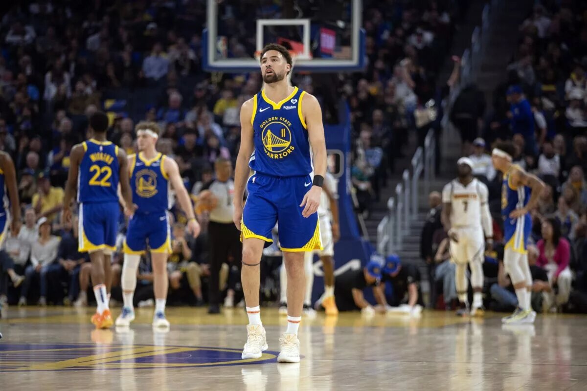 Feb 25, 2024; San Francisco, California, USA; Golden State Warriors guard Klay Thompson (11) walks back up court after being whistled for a foul against the Denver Nuggets during the first quarter at Chase Center. Mandatory Credit: D. Ross Cameron-USA TODAY Sports