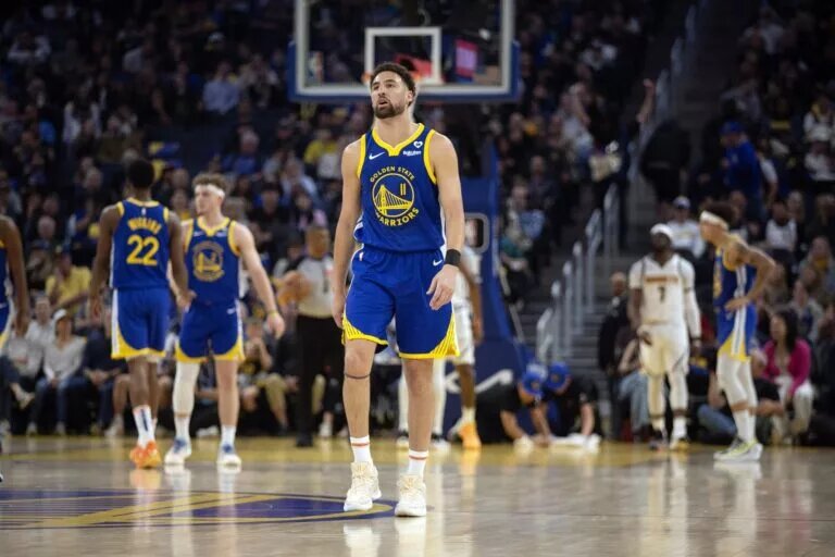 Feb 25, 2024; San Francisco, California, USA; Golden State Warriors guard Klay Thompson (11) walks back up court after being whistled for a foul against the Denver Nuggets during the first quarter at Chase Center. Mandatory Credit: D. Ross Cameron-USA TODAY Sports