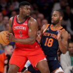 New Orleans Pelicans forward Zion Williamson (1) controls the ball against New York Knicks guard Alec Burks (18) during the second quarter at Madison Square Garden.