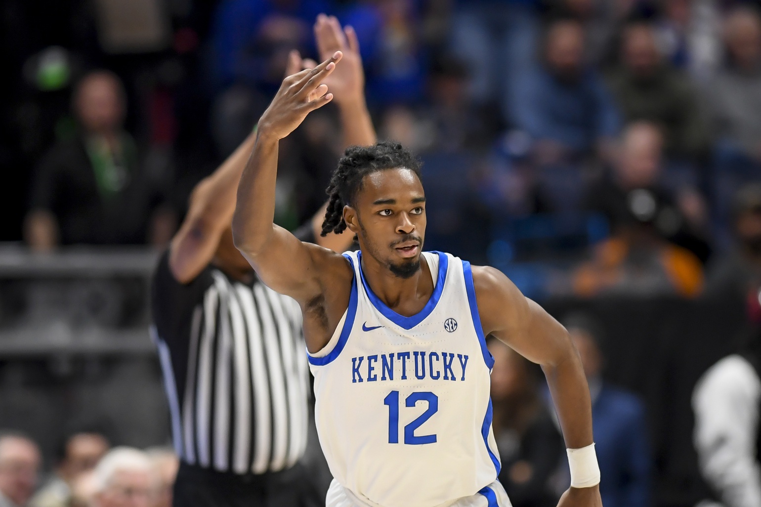 Kentucky Wildcats guard Antonio Reeves (12) celebrates his three point basket against the Texas A&M Aggies during the first half at Bridgestone Arena. Mandatory Credit: Steve Roberts-USA TODAY Sports