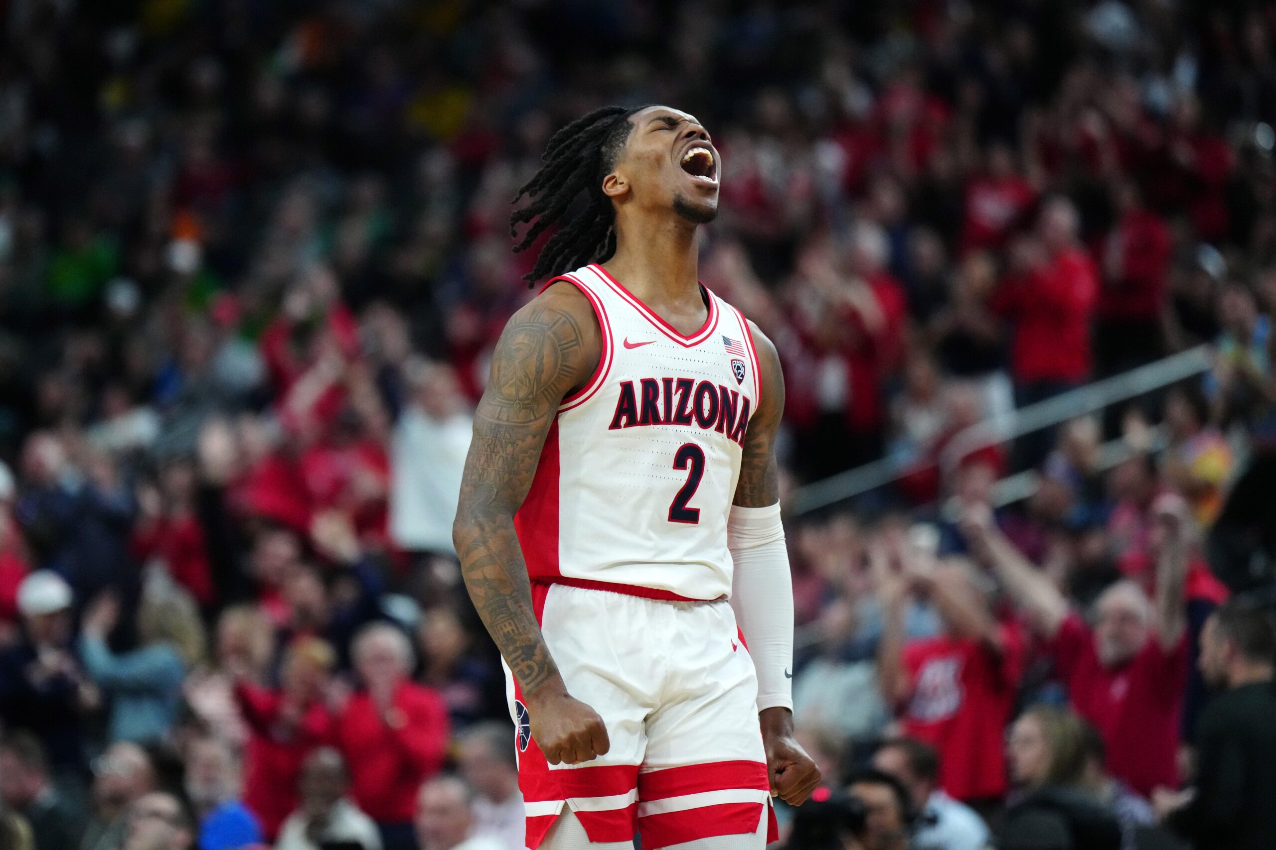 Arizona Wildcats guard Caleb Love (2) celebrates against the Southern California Trojans in the second half at T-Mobile Arena. Mandatory Credit: Kirby Lee-USA TODAY Sports