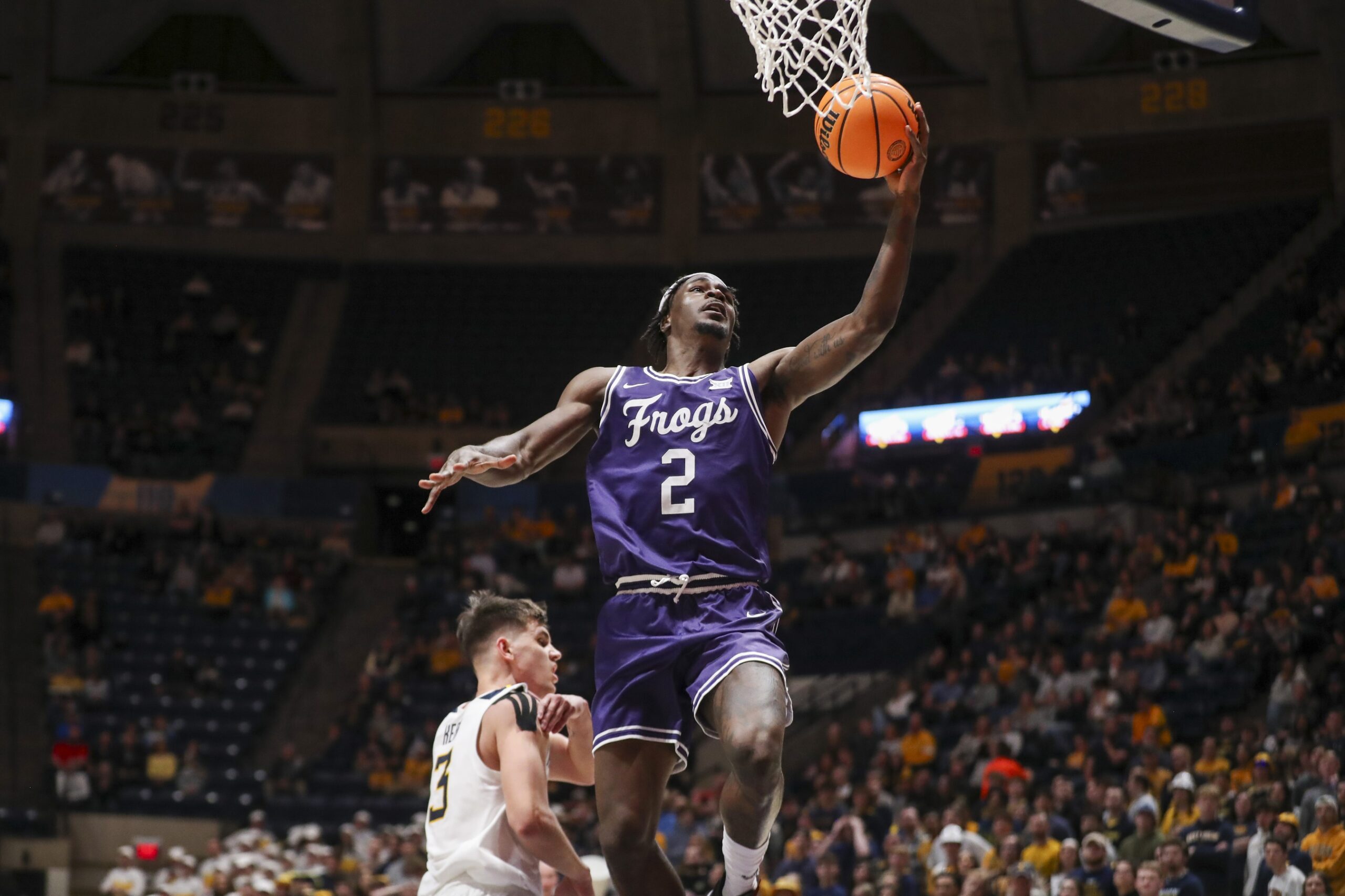 TCU Horned Frogs forward Emanuel Miller (2) shoots in the lane during the first half against the West Virginia Mountaineers at WVU Coliseum. Mandatory Credit: Ben Queen-USA TODAY Sports