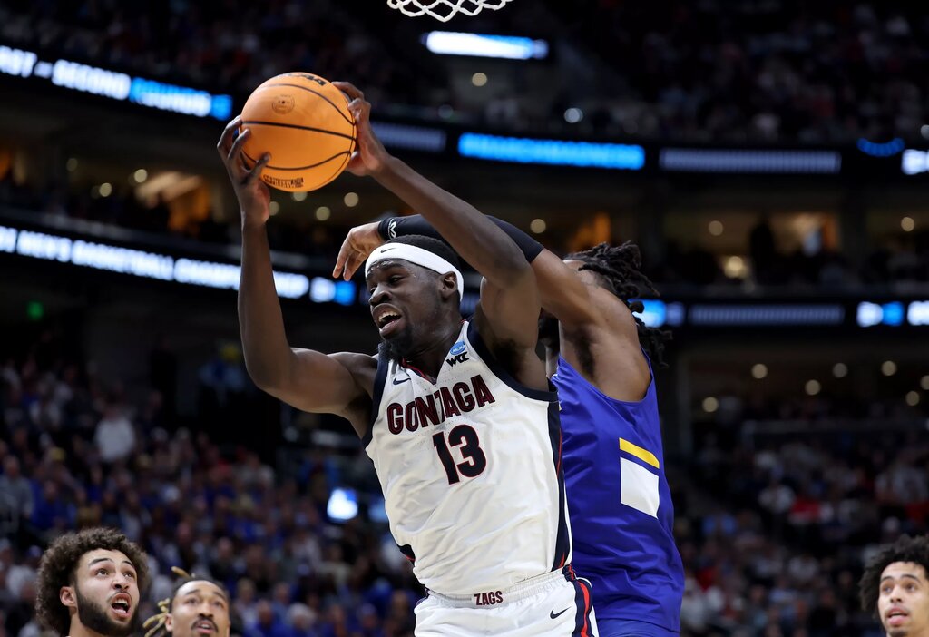 Gonzaga Bulldogs forward Graham Ike (13) grabs a rebound during the first half in the first round of the 2024 NCAA Tournament against the McNeese State Cowboys at Vivint Smart Home Arena-Delta Center. Mandatory Credit: Rob Gray-USA TODAY Sports