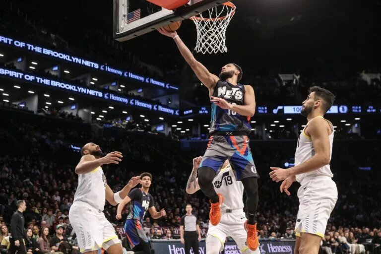 Nets guard Ben Simmons goes up for a layup