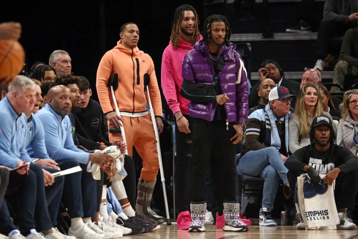 Desmond Bane. Ja Morant, and Brandon Clarke on the Grizzlies sideline with injury