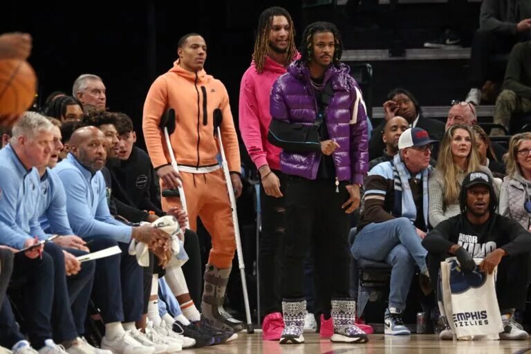 Desmond Bane. Ja Morant, and Brandon Clarke on the Grizzlies sideline with injury
