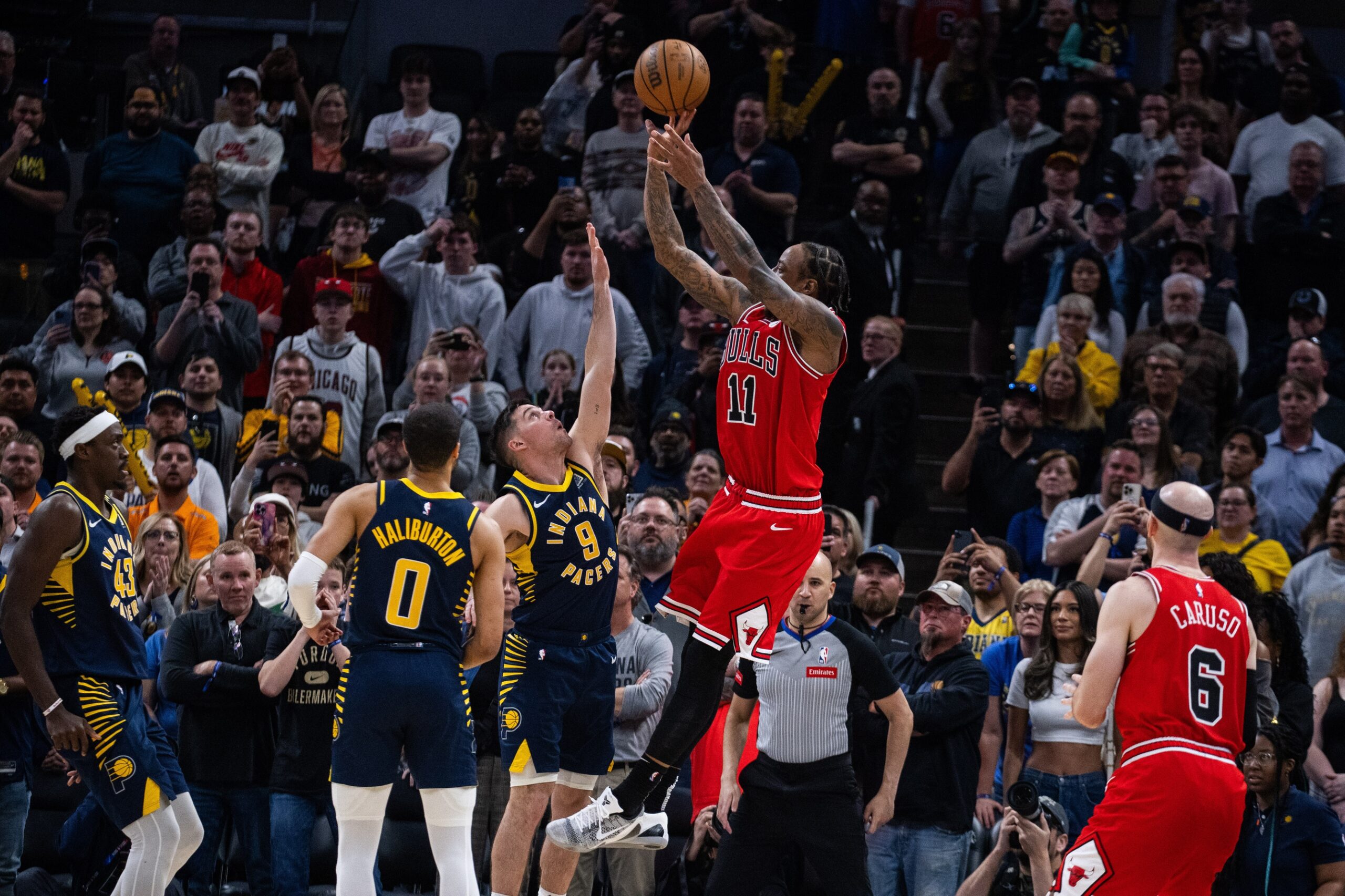 Chicago Bulls cornerstone DeMar DeRozan shoots over Indiana Pacers defense
