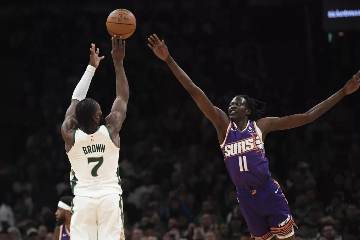 Boston Celtics wing Jaylen Brown shoots over Phoenix Suns forward Bol Bol