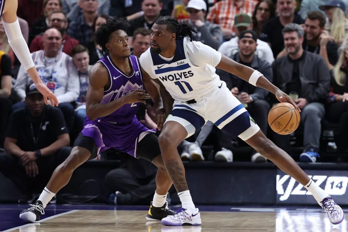Minnesota Timberwolves big man Naz Reid attempts to score as he vies for NBA Award