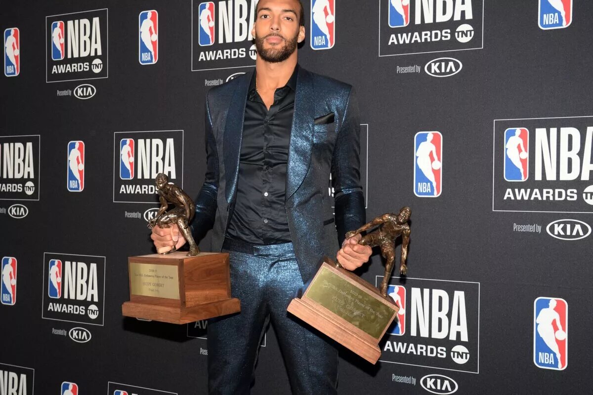 Rudy Gobert holds up Defensive Player of the Year Award at NBA Awards presentation