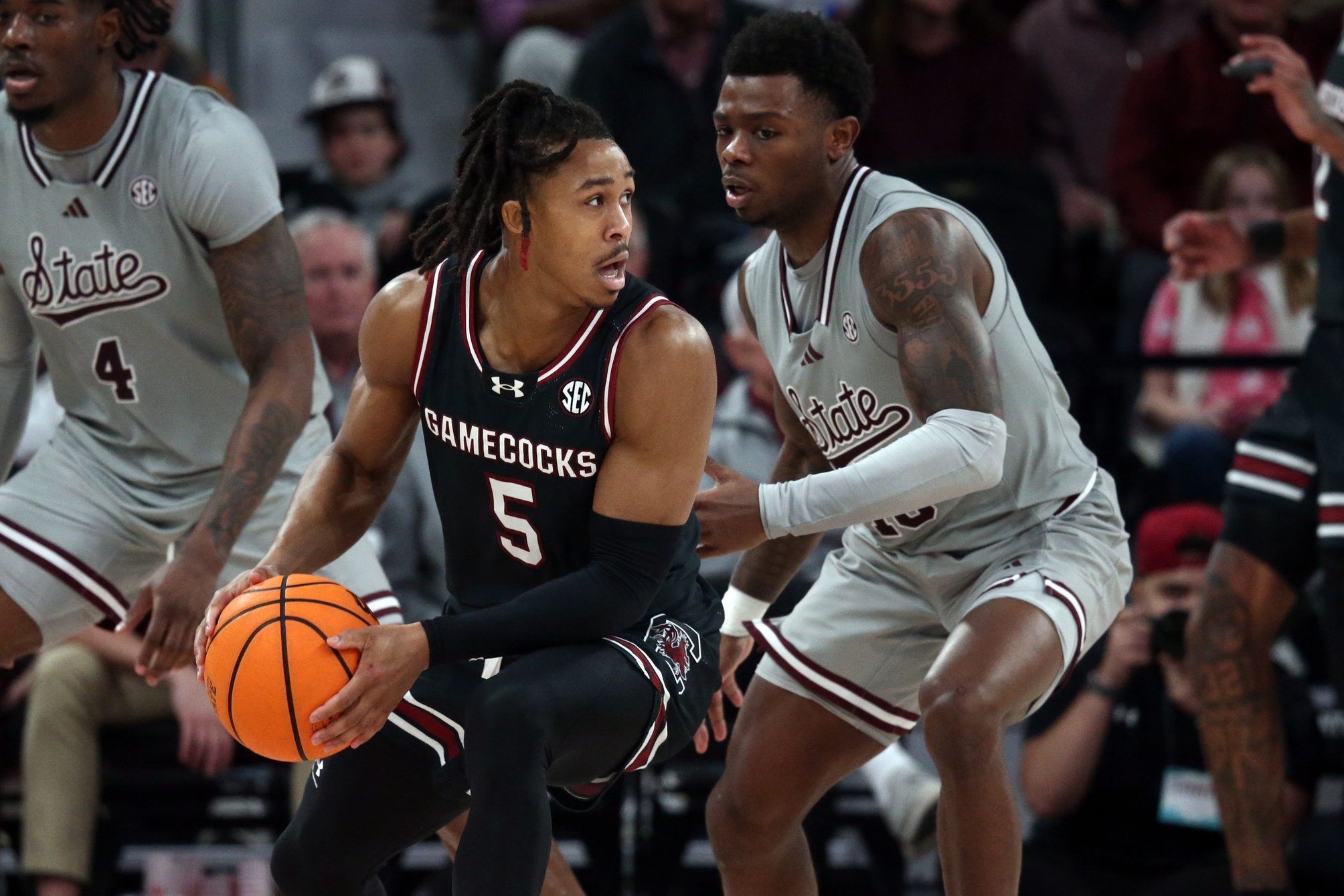 South Carolina Gamecocks guard Meechie Johnson (5) handles the ball as Mississippi State Bulldogs guard Dashawn Davis (10) defends during the second half at Humphrey Coliseum. Mandatory Credit: Petre Thomas-USA TODAY Sports