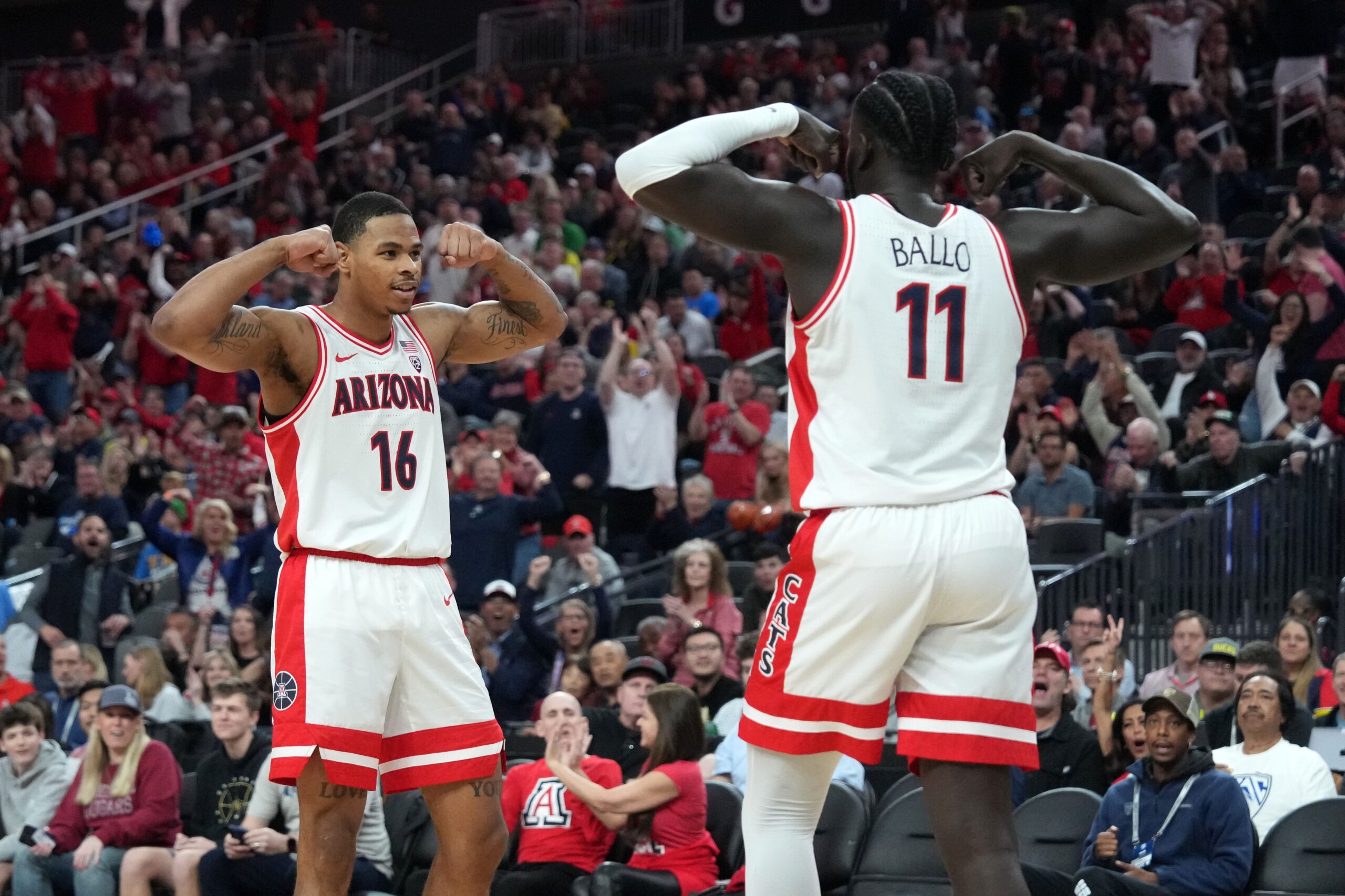 Arizona Wildcats center Oumar Ballo (11) and forward Keshad Johnson (16) celebrate in the first half against the Oregon Ducks at T-Mobile Arena. Mandatory Credit: Kirby Lee-USA TODAY Sports