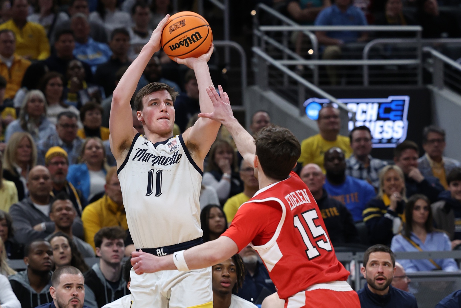 Marquette Golden Eagles guard Tyler Kolek (11) shoots against Western Kentucky Hilltoppers guard Jack Edelen (15) in the second half in the first round of the 2024 NCAA Tournament at Gainbridge FieldHouse. Mandatory Credit: Trevor Ruszkowski-USA TODAY Sports