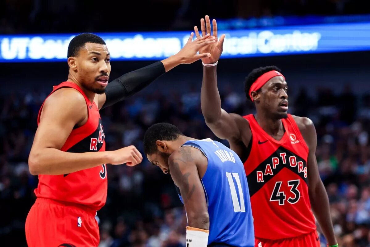 Nov 8, 2023; Dallas, Texas, USA; Toronto Raptors forward Otto Porter Jr. (32) and Toronto Raptors forward Pascal Siakam (43) celebrate over Dallas Mavericks guard Kyrie Irving (11) during the second half at American Airlines Center. Mandatory Credit: Kevin Jairaj-USA TODAY Sports