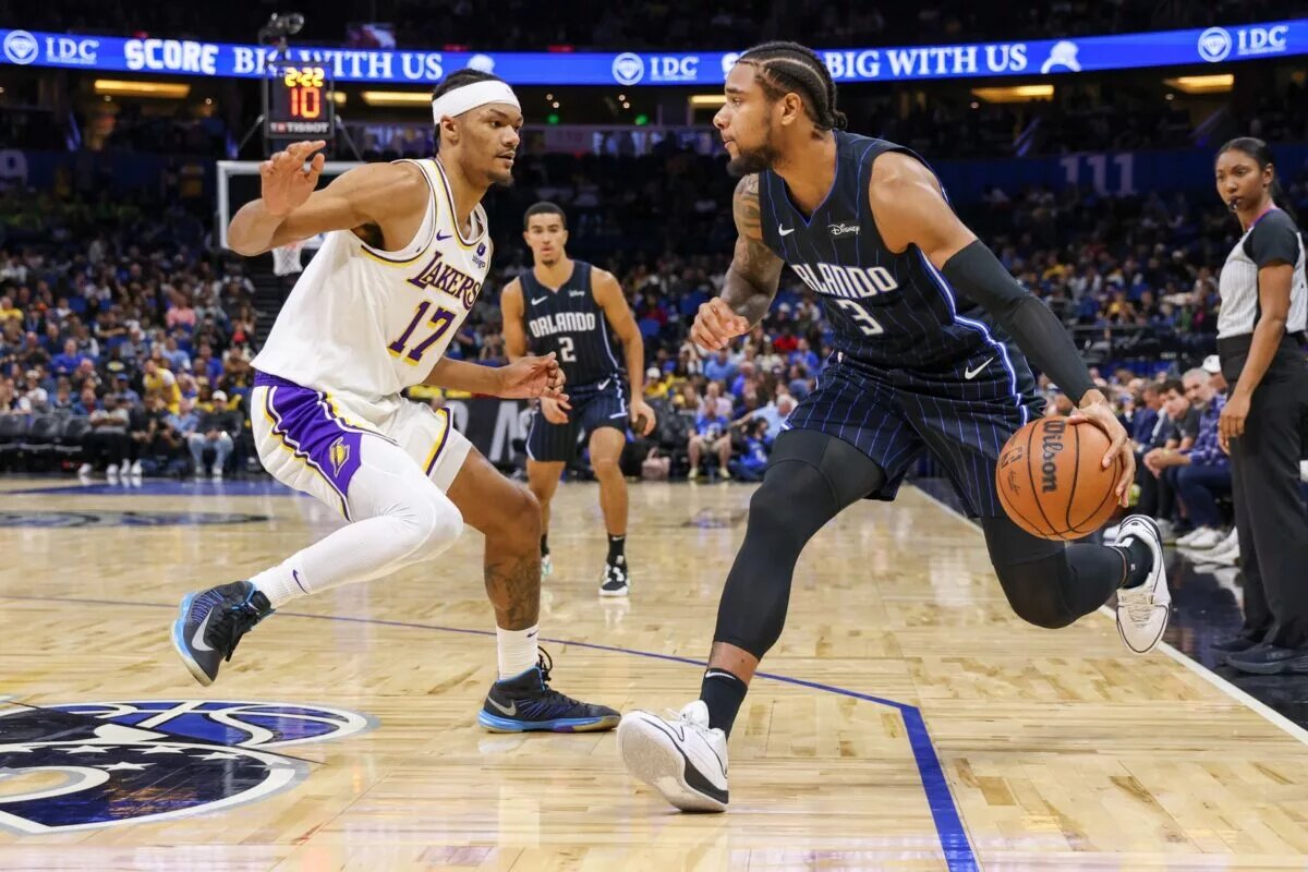Nov 4, 2023; Orlando, Florida, USA; Orlando Magic forward Chuma Okeke (3) drives around Los Angeles Lakers forward Alex Fudge (17) during the second half at Amway Center. Mandatory Credit: Mike Watters-USA TODAY Sports