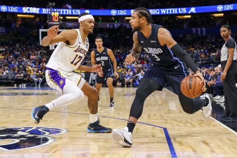 Nov 4, 2023; Orlando, Florida, USA; Orlando Magic forward Chuma Okeke (3) drives around Los Angeles Lakers forward Alex Fudge (17) during the second half at Amway Center. Mandatory Credit: Mike Watters-USA TODAY Sports
