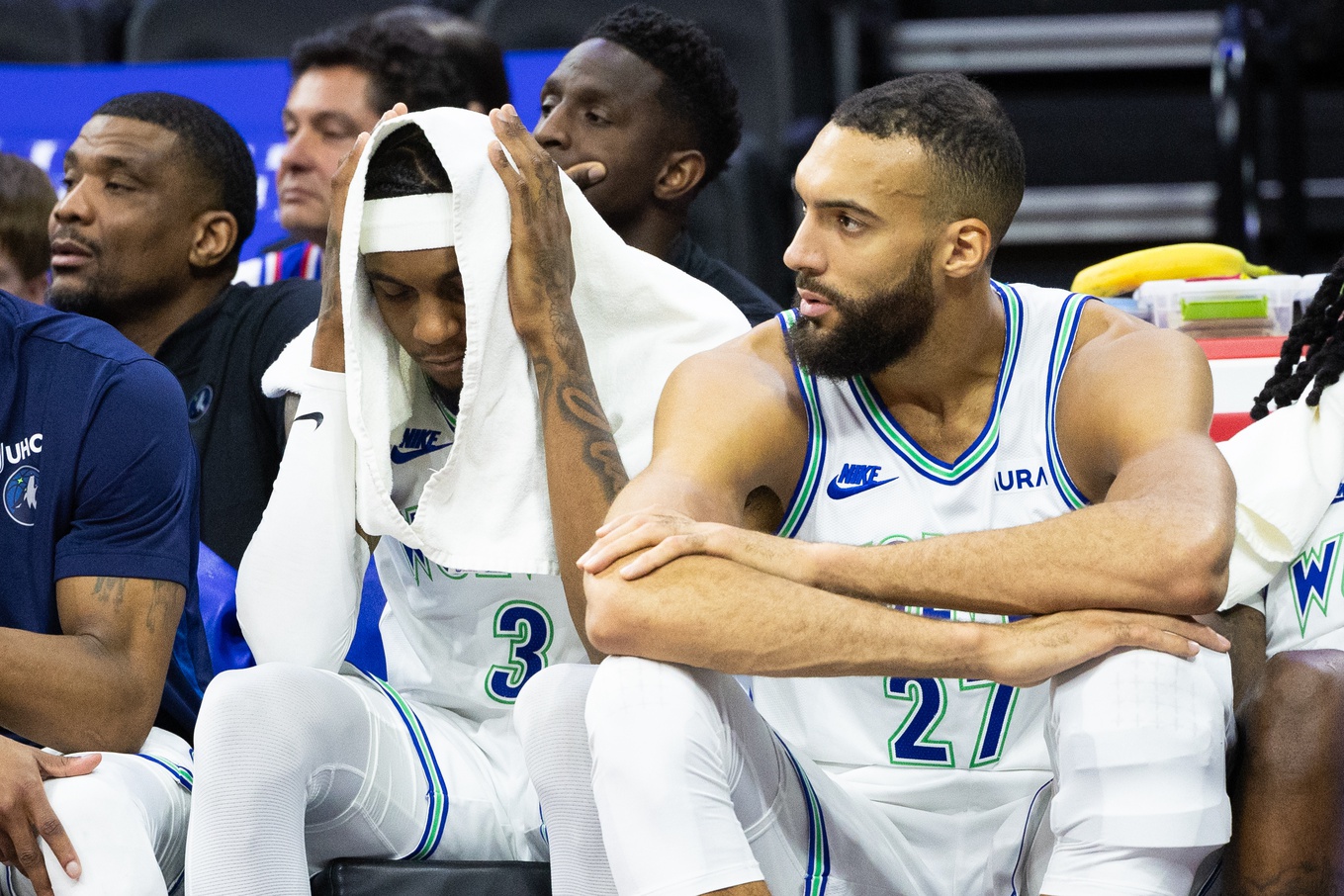 Minnesota Timberwolves forward Jaden McDaniels (3) and center Rudy Gobert (27) look on from the bench during the fourth quarter against the Philadelphia 76ers at Wells Fargo Center.