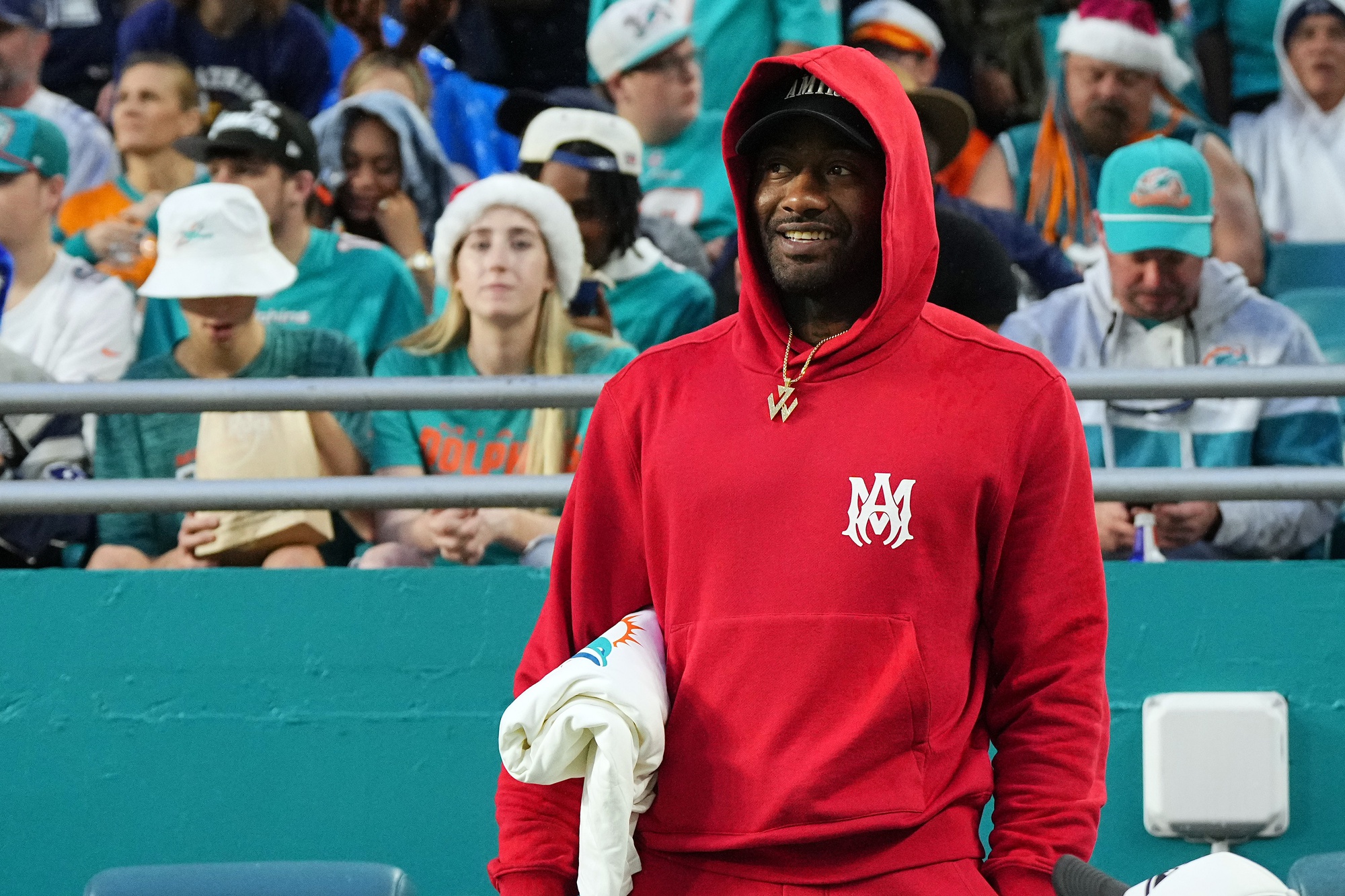 Dec 24, 2023; Miami Gardens, Florida, USA; Los Angeles Clippers guard John Wall watches the game between the Miami Dolphins and the Dallas Cowboys during the first half at Hard Rock Stadium. Mandatory Credit: Jasen Vinlove-USA TODAY Sports