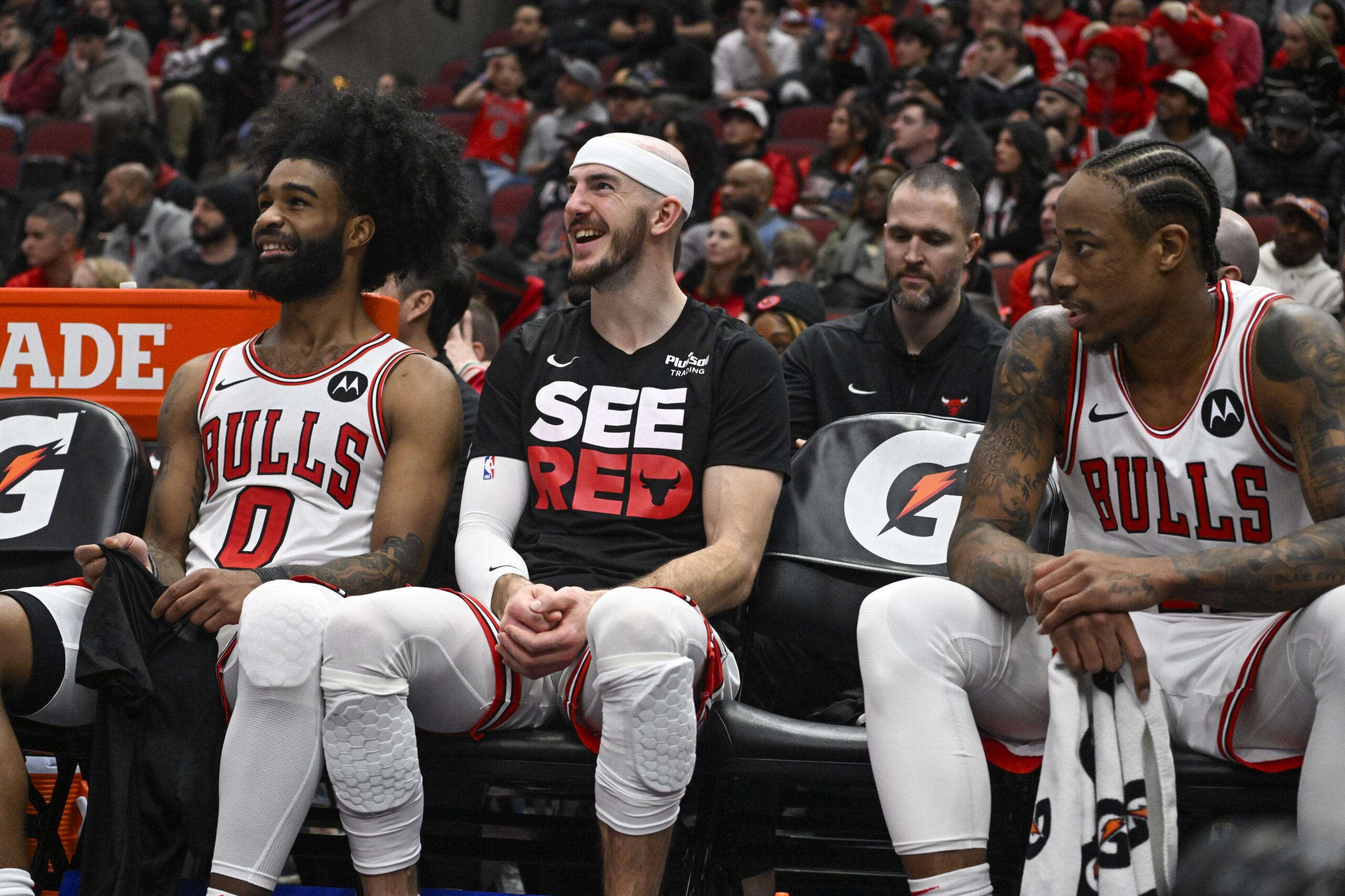 Coby White, Alex Caruso, and DeMar DeRozan of the Chicago Bulls