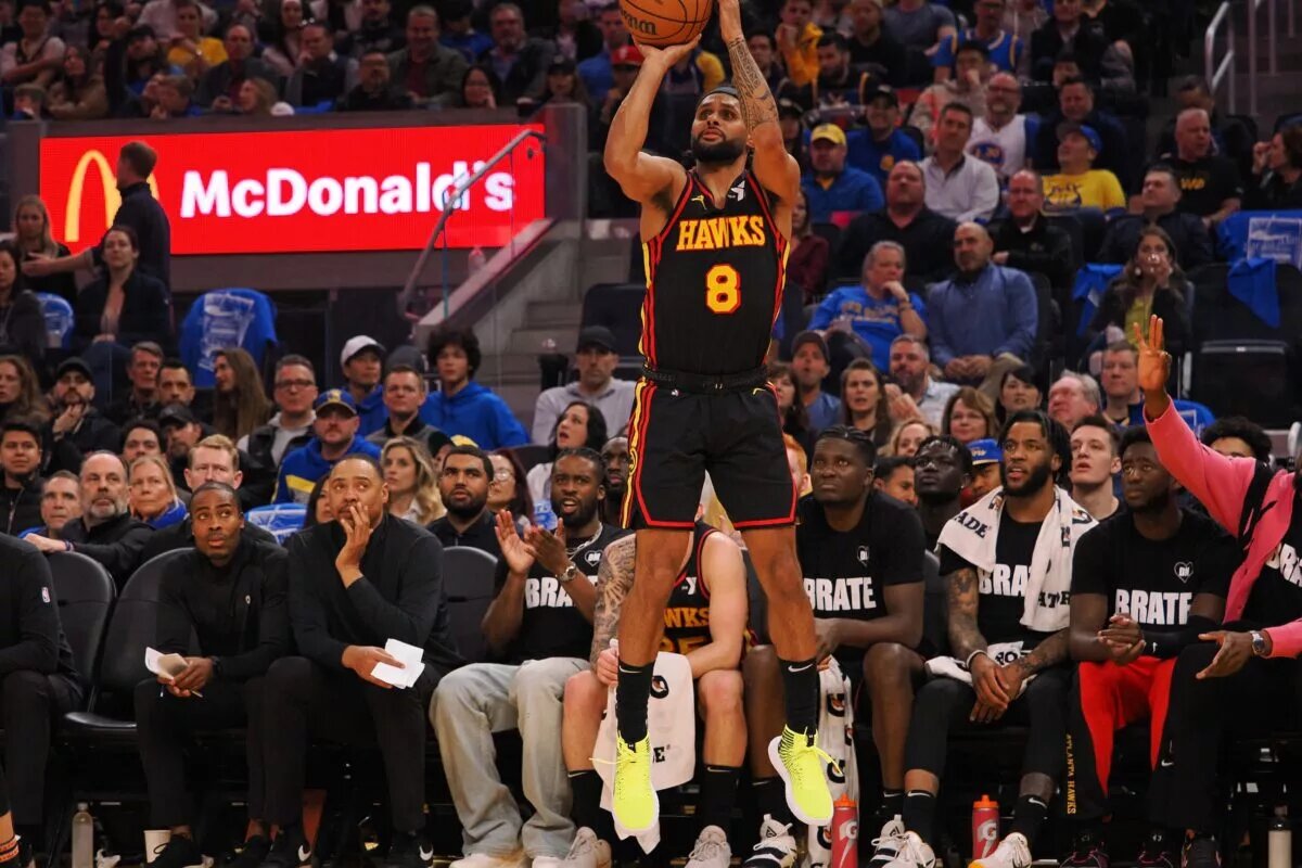 Jan 24, 2024; San Francisco, California, USA; Atlanta Hawks guard Patty Mills (8) scores a three point basket against the Golden State Warriors during the second quarter at Chase Center. Mandatory Credit: Kelley L Cox-USA TODAY Sports